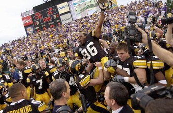 ORLANDO, FL - JANUARY 1:  Warren Holloway #86 of the Iowa Hawkeyes is carried on the field by teammates following the Capital One Bowl game against the LSU Tigers at the Florida Citrus Bowl on January 1, 2005 in Orlando, Florida. The Hawkeyes won 30-25. (