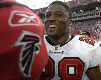 TAMPA, FL - SEPTEMBER 14: Running back Warrick Dunn #28 of the Tampa Bay Buccaneers smiles after play against the Atlanta Falcons at Raymond James Stadium on September 14, 2008 in Tampa, Florida.  The Buccaneers defeated the Falcons 24-9. (Photo by Al Mes