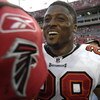 TAMPA, FL - SEPTEMBER 14: Running back Warrick Dunn #28 of the Tampa Bay Buccaneers smiles after play against the Atlanta Falcons at Raymond James Stadium on September 14, 2008 in Tampa, Florida.  The Buccaneers defeated the Falcons 24-9. (Photo by Al Mes