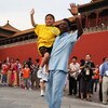 BEIJING - AUGUST 23:  Brazilian football legend Edson Arantes do Nacimento, known as Pele, holds nine-year-old Sichuan province earthquake youth survivor Lin Hao as he meets Sichuan province earthquake youth survivors in front of the Forbidden City on Aug