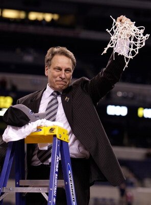 INDIANAPOLIS - MARCH 29:  Head coach Tom Izzo of the Michigan State Spartans celebrates after he cut down the net following their 64-52 win against the Louisville Cardinals  during the fourth round of the NCAA Division I Men's Basketball Tournament at the