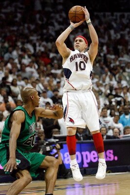 ATLANTA - MAY 02:  Mike Bibby #10 of the Atlanta Hawks makes a shot over Ray Allen #20 of the Boston Celtics in Game Six of the Eastern Conference Quarterfinals during the 2008 NBA Playoffs at Phillips Arena on May 2, 2008 in Atlanta Georgia. The Hawks de