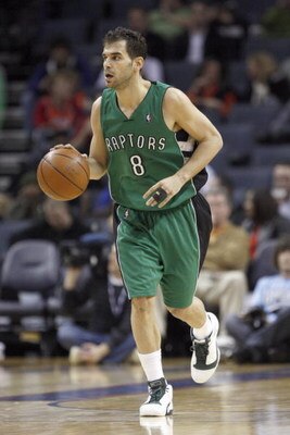 CHARLOTTE, NC - MARCH 16:  Jose Calderon #8 of the Toronto Raptors dribbles downcourt against the Charlotte Bobcats during their game at Time Warner Cable Arena on March 16, 2009 in Charlotte, North Carolina.  NOTE TO USER: User expressly acknowledges and