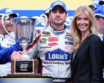 MARTINSVILLE, VA - MARCH 29:  Jimmie Johnson, driver of the #48 Lowe's Chevrolet, celebrates in victory lane with his wife, Chandra Johnson, after winning the NASCAR Sprint Cup Series Goody's Fast Pain Relief 500 at the Martinsville Speedway on March 29, 