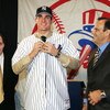 NEW YORK - DECEMBER 22:  (L to R) New York Yankees general manger Brian Cashman  with Carl Pavano and manger Joe Torre at a press conference where the Yankees announced that they have signed free-agent right-handed pitcher Carl Pavano to a four-year contr