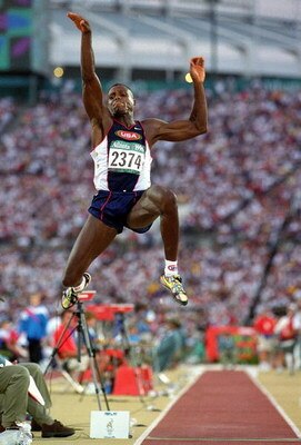 GEORGIA, US - JULY 29:  Carl Lewis of the USA makes the winning Long Jump 8.50ft during the 1996 Olympic Games at the Olympic Stadium July 29, 1996 in Atlanta, Georgia. (Photo by Mike Powell/Getty Images) 