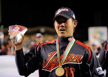 LOS ANGELES, CA - MARCH 23:  Daisuke Matsuzaka #18 of Japan holds up the the MVP trophy after defeating Korea during the finals of the 2009 World Baseball Classic on March 23, 2009 at Dodger Stadium in Los Angeles, California. Japan won 5-3 in 10 innings.