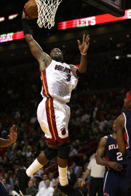 MIAMI - DECEMBER 12:  Dwyane Wade #3 of the Miami Heat scores against the Atlanta Hawks at American Airlines Arena on December 12, 2008 in Miami, Florida. NOTE TO USER: User expressly acknowledges and agrees that, by downloading and/or using this Photogra