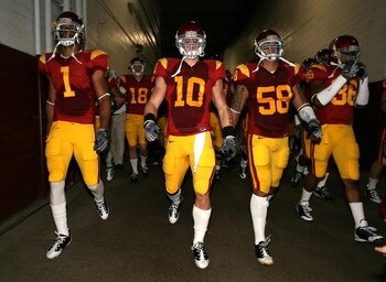 LOS ANGELES, CA - NOVEMBER 29:  (L-R) Patrick Turner #1, Brian Cushing #10 and Rey Maualuga #58 of the USC Trojans walk out to the field before the game against the Notre Dame Fighting Irish at Los Angeles Memorial Coliseum on November 29, 2008 in Los Ang