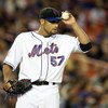 NEW YORK - SEPTEMBER 23:  Johan Santana #57 of the New York Mets adjusts his hat after the third inning against the Chicago Cubs during their game at Shea Stadium September 23, 2008 in the Flushing neighborhood of the Queens borough of New York City.  (Ph