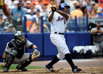 NEW YORK - JUNE 29: Carlos Delgado #21 of the New York Mets hits a solo home run in the third inning against the New York Yankees at Shea Stadium on June 29, 2008 in the Flushing neighborhood of the Queens borough of New York City.  (Photo by Jeff Zelevan