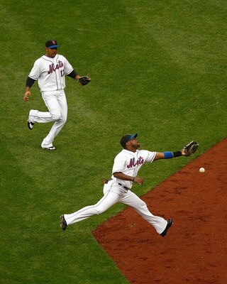 NEW YORK - APRIL 03: Second baseman Luis Castillo of the New York Mets comes up short on a fly ball hit by Dustin Pedroia of the Boston Red Sox on April 3, 2009 at Citi Field in the Flushing neighborhood of the Queens borough of New York City. The game ma