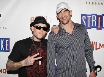 NEW YORK - OCTOBER 07:  Olympic gold medalist Michael Phelps and Benji Madden of the rock band Good Charlotte pose for a photo on the red carpet at Bowlmor Lanes 70th Anniversary party on October 7, 2008 at Bowlmor Lanes in New York City.  (Photo by Mike 