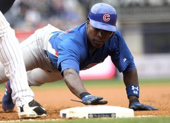 NEW YORK - APRIL 04: Alfonso Soriano #12 of the Chicago Cubs dives back into first base against the New York Yankees during their game on April 4, 2009 at Yankee Stadium in the Bronx borough of New York City.  (Photo by Nick Laham/Getty Images)