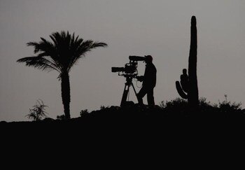 DOHA, QATAR - JANUARY 23:  A TV cameraman films play during the second round of  the Commercialbank Qatar Masters at Doha Golf Club on January 23, 2009 in Doha, Qatar.  (Photo by Andrew Redington/Getty Images)