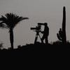 DOHA, QATAR - JANUARY 23:  A TV cameraman films play during the second round of  the Commercialbank Qatar Masters at Doha Golf Club on January 23, 2009 in Doha, Qatar.  (Photo by Andrew Redington/Getty Images)