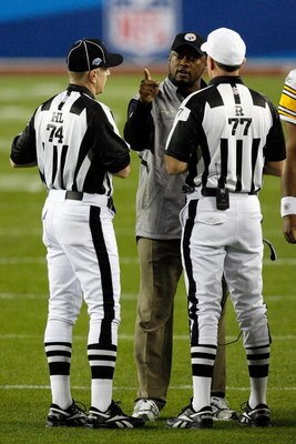 TAMPA, FL - FEBRUARY 01:  Head coach Mike Tomlin of the Pittsburgh Steelers argues with head linesman Derick Bowers #74 and referee Terry McAulay #77 against the Arizona Cardinals during Super Bowl XLIII on February 1, 2009 at Raymond James Stadium in Tam