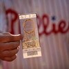 PHILADELPHIA - APRIL 05:  A Philadelphia Philliles fan shows his ticket to the Phillies game against the Atlanta Braves on April 5, 2009 at Citizens Bank Park in Philadelphia, Pennsylvania. Today's game is the opening of the 2009 major league baseball sea