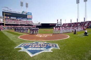 CINCINNATI - APRIL 4:  Players for the New York Mets and the Cincinnati Reds line up on the field for a moment of silence in rememberance of Pope John Paul before the start of their opening day ballgame on April 4, 2005 at Great American Ballpark in Cinci