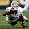 CHARLOTTE, NC - DECEMBER 27:  Shaun Draughn #20 of the North Carolina Tar Heels dives with the ball against the West Virginia Mountaineers during the Meineke Car Care Bowl on December 27, 2008 at Bank of America Stadium in Charlotte, North Carolina.  (Pho