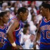 1988:  Guard Isiah Thomas, left, forward Dennis Rodman, right, and forward Vinnie Johnson of the Detroit Pistons talk to each other during a game. Mandatory Credit: Allsport  /Allsport