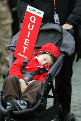SHANGHAI, CHINA - NOVEMBER 09:  A young golf fan sleeps during the forth round of the HSBC Champions at Sheshan Golf Club on November 9, 2008 in Shanghai, China.  (Photo by Ross Kinnaird/Getty Images)