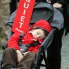 SHANGHAI, CHINA - NOVEMBER 09:  A young golf fan sleeps during the forth round of the HSBC Champions at Sheshan Golf Club on November 9, 2008 in Shanghai, China.  (Photo by Ross Kinnaird/Getty Images)