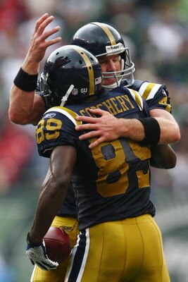 EAST RUTHERFORD, NJ - SEPTEMBER 28:  Jerricho Cotchery #89 of the New York Jets celebrates his touchdown with quarterback Brett Favre #4 against the Arizona Cardinals on September 28, 2008 at Giants Stadium in East Rutherford, New Jersey.  (Photo by Chris