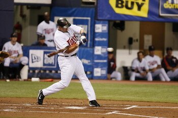 MINNEAPOLIS, MN - APRIL 2:  Michael Cuddyer #5 of the Minnesota Twins swings at a pitch against the Baltimore Orioles during the Opening Day game on April 2, 2007 at the Metrodome in Minneapolis, Minnesota.  The Twins won 7-4.  (Photo by Scott A. Schneide
