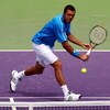 KEY BISCAYNE, FL - MARCH 31:  Jo-Wilfried Tsonga of France returns a shot against Gilles Simon of France during day nine of the Sony Ericsson Open at the Crandon Park Tennis Center on March 31, 2009 in Key Biscayne, Florida.  (Photo by Clive Brunskill/Get
