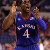 INDIANAPOLIS - MARCH 27:  Sherron Collins #4 of the Kansas Jayhawks reacts in the first half against the Michigan State Spartans during the third round of the NCAA Division I Men's Basketball Tournament at the Lucas Oil Stadium on March 27, 2009 in Indian
