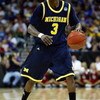 KANSAS CITY, MO - MARCH 21:  Manny Harris #3 of the Michigan Wolverines dribbles the ball against the Oklahoma Sooners during the second round of the NCAA Division I Men's Basketball Tournament at the Sprint Center on March 21, 2009 in Kansas City, Missou