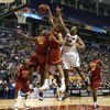 MINNEAPOLIS - MARCH 20:  DeMar DeRozan #10 and Daniel Hackett #13 of the USC Trojans fight for a rebound against Josh Southern #52 of the Boston College Eagles during the first round of the NCAA Division I Men's Basketball Tournament at the Hubert H. Hump