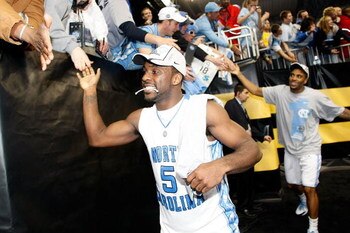 DETROIT - APRIL 06:  Ty Lawson #5 and Wayne Ellington #22 of the North Carolina Tar Heels celebrate with fans as they run off the court after the Tar Heels 89-72 win against the Michigan State Spartans during the 2009 NCAA Division I Men's Basketball Nati