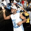 DETROIT - APRIL 06:  Ty Lawson #5 and Wayne Ellington #22 of the North Carolina Tar Heels celebrate with fans as they run off the court after the Tar Heels 89-72 win against the Michigan State Spartans during the 2009 NCAA Division I Men's Basketball Nati