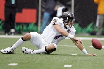 CINCINNATI - NOVEMBER 27:  Kyle Boller #7 of the Baltimore Ravens fumbles as he drops back to pass against the Cincinnati Bengals on November 27, 2005 at Paul Brown Stadium in Cincinnati, Ohio.  (Photo by Andy Lyons/Getty Images)