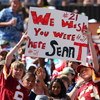 HONOLULU, HI - FEBRUARY 10:  Young fans hold up a sign in memory of Sean Taylor #21 of the NFC's Washington Redskins during the game against the AFC at the 2008 NFL Pro Bowl at Aloha Stadium on February 10, 2008 in Honolulu, Hawaii. (Photo by Paul Spinell