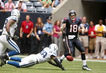 HOUSTON - OCTOBER 05:  Defensive end Robert Mathis #98 of the Indianapolis Colts strips the ball from quarterback Sage Rosenfels #18 of the Houston Texans late in the fourth quarter on October 5, 2008 at Reliant Stadium in Houston, Texas.  The play set up