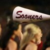 MIAMI - JANUARY 08:  Cheerleaders from the Oklahoma Sooners hold up a megaphone against the Florida Gators during the FedEx BCS National Championship game at Dolphin Stadium on January 8, 2009 in Miami, Florida.  (Photo by Doug Benc/Getty Images)