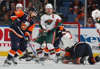 UNIONDALE, NY - MARCH 25:  Owen Nolan #11 of the Minnesota Wild skates against the New York Islanders on March 25, 2009 at the Nassau Coliseum in Uniondale, New York.  (Photo by Bruce Bennett/Getty Images)