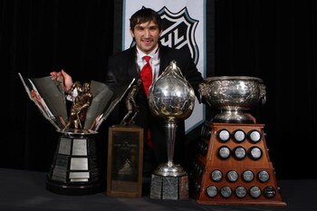 TORONTO, ON - JUNE 12:  Alexander Ovechkin of the Washington Capitals poses with the Hart Memorial Trophy, the Lester B. Pearson Award, the Art Ross Trophy and the Maurice 'Rocket' Richard Trophy during the 2008 NHL Awards at the at the Elgin Theatre on J