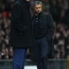 MANCHESTER, UNITED KINGDOM - MARCH 11:  Manchester United Manager Sir Alex Ferguson (L) and Inter Milan Manager Jose Mourinho watch the action during the UEFA Champions League Round of Sixteen, Second Leg match between Manchester United and Inter Milan at