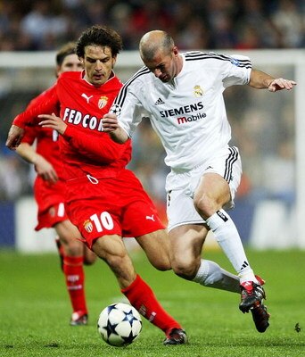 MADRID, SPAIN - MARCH 24:  Zinedine Zidane of Real Madrid is tackled by Fernando Morientes of Monaco during the UEFA Champions League Quarter Final match between Real Madrid and Monaco at The Bernabeu on March 24, 2004 in Madrid, Spain.  (Photo by Clive M