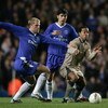 LONDON - MARCH 8: Eidur Gudjohnsen of Chelsea battles with Ronaldinho of Barcelona during the UEFA Champions League, First Knockout Round, Second Leg match between Chelsea and Barcelona at Stamford Bridge on March 8, 2005 in London, England.  (Photo by Be