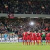 LIVERPOOL, UNITED KINGDOM - APRIL 5:  Juventus and Liverpool players stand with arms locked for one minutes silence commemorating the 20th anniversary of the Heysel Stadium disaster prior to the UEFA Champions League Quater-final, first leg match between 
