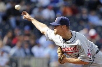 KANSAS CITY, MO - APRIL 15:  Kerry Wood of the Cleveland Indians, wearing a #42 jersey during the Jackie Robinson Day game throws a pitch in the ninth inning against the Kansas City Royals on April 15, 2009 at Kauffman Stadium in Kansas City, Missouri.  (