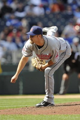 KANSAS CITY, MO - APRIL 15:  Kerry Wood of the Cleveland Indians, wearing a #42 jersey during the Jackie Robinson Day game throws a pitch in the ninth inning against the Kansas City Royals on April 15, 2009 at Kauffman Stadium in Kansas City, Missouri.  (