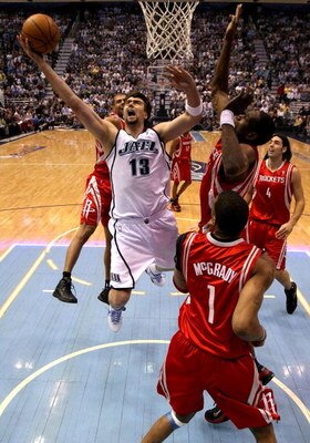 SALT LAKE CITY - APRIL 26:  Mehmet Okur #13 of the Utah Jazz lays up the ball against the Houston Rockets in Game Four of the Western Conference Quarterfinals during the 2008 NBA Playoffs at Energy Solutions Arena on April 26, 2008 in Salt Lake City, Utah