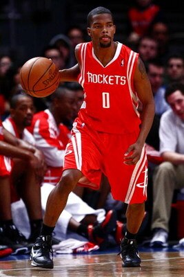 NEW YORK - JANUARY 26:  Aaron Brooks #0 of the Houston Rockets drives against the New York Knicks on January 26, 2009 at Madison Square Garden in New York City.  NOTE TO USER: User expressly acknowledges and agrees that, by downloading and/or using this P
