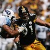 PITTSBURGH - SEPTEMBER 11:  Defensive end Aaron Smith #91 of the Pittsburgh Steelers tries to get around tackle Jacob Bell #60 of the Tennessee Titans during a game at Heinz Field on September 11, 2005 in Pittsburgh, Pennsylvania.  The Steelers defeated t
